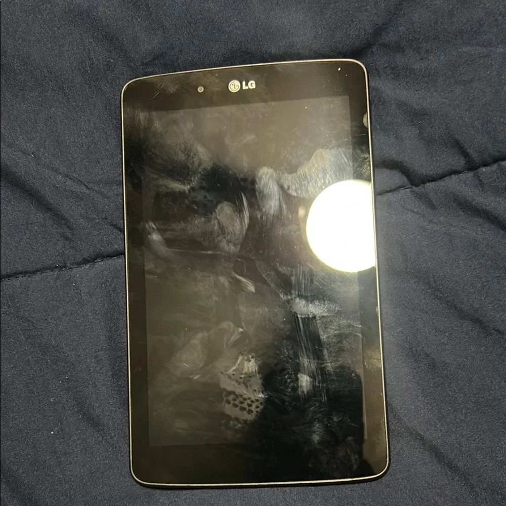 LG Black Tablet with Reflective Screen and Rounded Corners